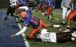 Bishop Gorman quarterback Anu Solomon dives into the end zone against Cimarron-Memorial during the Sunrise Division championship game Friday. Bishop Gorman won the game to advance to the state semifinals.