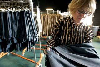 Designer Jhane Barnes looks at one of the uniforms she designed at CityCenter's Uniform Distribution Center on Industrial Road in Las Vegas on Tuesday, Nov. 10, 2009. 