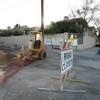 Construction equipment rests Friday at the Tenaya Way overpass and the San Moritz housing developmen