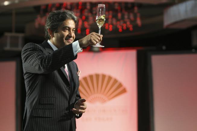 Hotel General Manager Rajesh Jhingon makes a toast to the 400 newly hired colleagues during the "Day of Delight" event hosted Saturday at the Mandarin Oriental.