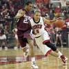 UNLV's Derrick Jasper is covered by Justin Bocot as he takes the ball down the court against Southern Illinois at the Thomas & Mack Center Saturday.