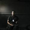 Tony McDew, at a bus stop on Spring Mountain Road across from the Fashion Show Mall, holds video camera that he has used to document his struggle with gambling addiction. While he was gambling, money problems forced him to ride the bus regularly.