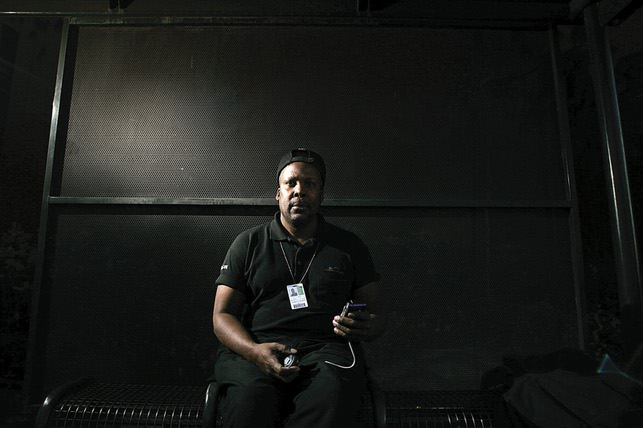 Tony McDew, at a bus stop on Spring Mountain Road across from the Fashion Show Mall, holds video camera that he has used to document his struggle with gambling addiction. While he was gambling, money problems forced him to ride the bus regularly.