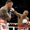 Andre Ward, right, punches Mikkel Kessler, from Denmark, during the second round of their WBA Super Middleweight championship boxing fight in Oakland, Calif., Saturday, Nov. 21, 2009. Ward won by unanimous technical decision. A ringside doctor stopped the fight in the 11th round after checking on Kessler.