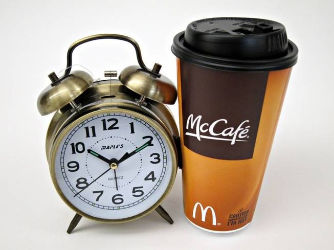 80. A charming alarm clock with a double-mallet bell design and two coupons for free small hot or medium iced McCafe Coffee, expires Dec. 31, 2009. Also included is a McCafe key chain.
