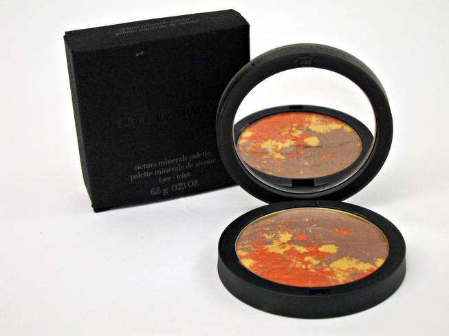 60. Giorgio Armani mirrored black compact of Sienna Minerals Palette includes an all-over blush of sun-splashed colors including sandy copper, sienna red and a deep reddish-brown glow. (Retail $65)  
