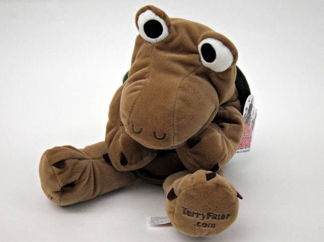 21. Terry Fator "The Million Dollar Voice" sent a stuffed animal/hand puppet, Winston Jr. It's a mostly brown turtle with a green felt shell. The front says I (heart) Terry Fator. (Retail $30)
