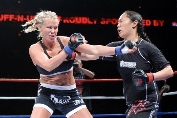 Latasha Marzolla trades punches with her opponent during a Tuff-N-Uff fight. 