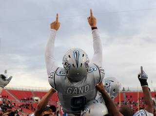 The Las Vegas Locomotives hold up kicker Graham Gano after he kicked in the game winning field goal in overtime for their 20-17 win over the Florida Tuskers in the UFL Championship game Friday at Sam Boyd Stadium.
