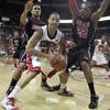 UNLV guard Tre'Von Willis is pressured by Louisville guard Peyton Siva, left, and forward George Goode during the second half of Saturday's game at the Thomas & Mack Center. The Rebels upset the 16th-ranked Cardinals 76-71. UNLV guard Tre'Von Willis is pressured by Louisville guard Peyton Siva, left, and forward George Goode during the second half of Saturday's game at the Thomas & Mack Center. The Rebels upset the 16th-ranked Cardinals 76-71.