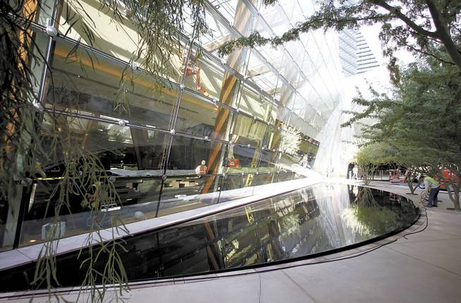 A reflecting pool surrounded by trees is one of the features of a pocket park between Aria, CityCenter's only gaming hotel, and the Crystals retail and dining area. 