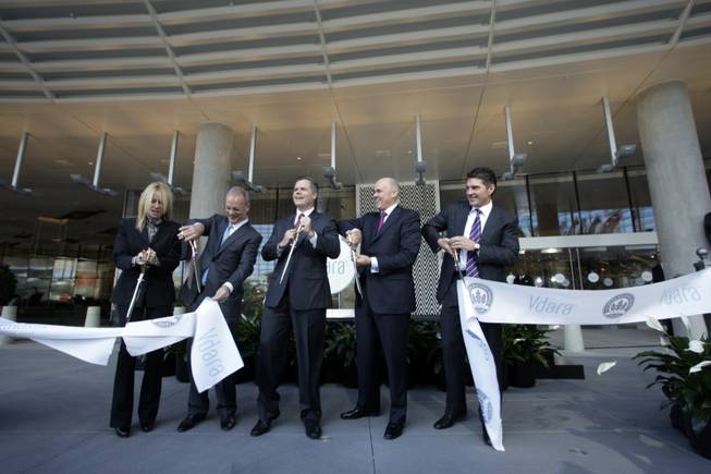 MGM Mirage executives cut a ribbon during the opening of ...
