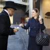 
Doorman Reggie Horsford interacts with Anja Luthje, corporate director of rooms, during a training simulation at the Mandarin Oriental.