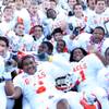 Members of the Bishop Gorman High football team pose for a photo with the state championship trophy Saturday after beating Del Sol 62-21 in the large-school title game at Sam Boyd Stadium.