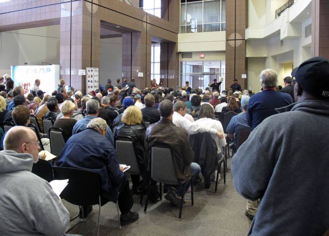 The standing-room only crowd at the State Treasurer's Unclaimed Property Division's auction Saturday at the Grant Sawyer Building came to bid on jewelry, coins and other small items.