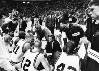 Current UNLV coach Lon Kruger offers instructions during his days as head coach at Kansas State - his alma mater. Kruger held the post in Manhattan, Kan., from 1986-90. Over his shoulder is current UNLV assistant Greg Grensing, while Steve Henson, another current Rebels aide, is seated on the bench (No. 12). Mike Shepherd, who is UNLV's director of basketball operations, was then a student manager for Kruger, and is on the far left (in white). The Rebels take on the Wildcats this Saturday at 4 p.m. at the Orleans Arena.