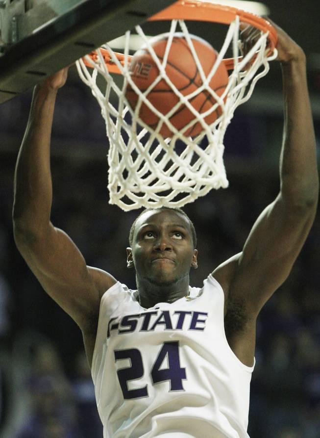 Kansas State junior forward Curtis Kelly slams home two points in a victory over Xavier on Tuesday night. Kelly chose K-State over UNLV two years ago when transferring from UConn, and now faces the No. 18 Rebels on Saturday at 4 p.m. at the Orleans Arena.