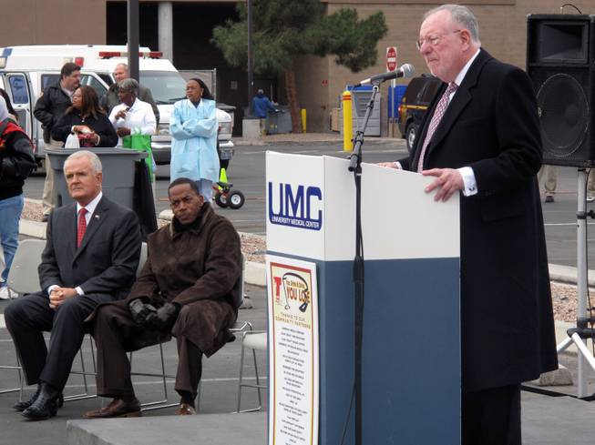 Gov. Jim Gibbons and Clark County Commissioner Lawrence Weekly listen as Las Vegas Mayor Oscar Goodman speaks to high school students outside University Medical Center.