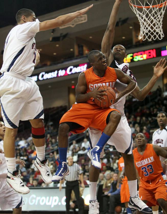 Bishop Gorman High point guard Johnathan Loyd, drives to the basket against Findlay Prep at the Orleans Arena in 2009 in this file photo.