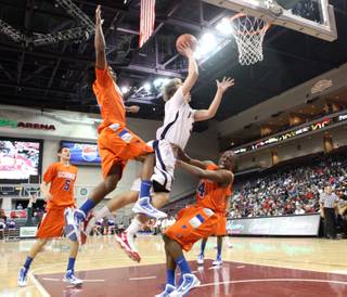 Marko Petrovic of Findlay Prep scores over the Bishop Gorman defense during Saturday's game at the Orleans Arena.