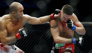 B.J. Penn lands a left hook to Diego Sanchez during their lightweight championship fight at FedEx Forum in Memphis, Tenn., on Dec. 12, 2009. Penn ended up winning the fight by TKO in the final round.