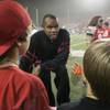 Former UNLV quarterback and NFL star Randall Cunningham talks to some young fans before the start of UNLV's game against Utah on Oct. 17 at Sam Boyd Stadium. Cunnigham joined the Silverado High football coaching staff as offensive coordinator recently.