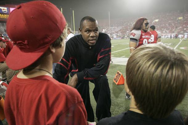 Former UNLV quarterback and NFL star Randall Cunningham talks to young fans before the start of UNLV's game against Utah on Oct. 17, 2009, at Sam Boyd Stadium. Cunnigham recently joined the Silverado High football coaching staff as offensive coordinator.