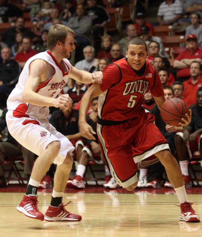 UNLV guard Derrick Jasper drives past Davis Baker on Dec. 15 as the Rebels took on Southern Utah at the Centrum Arena in Cedar City, Utah. UNLV dominated the second half and came out with a 77-59 win.

