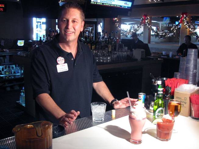 Bartender Dale Moon shows off some non-alcoholic drinks for designated drivers to enjoy at the T-Bird Lounge and Restaurant.