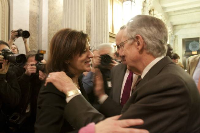 Victoria Reggie Kennedy, widow of the late Sen. Ted Kennedy, greets Senate Majority Leader Harry Reid, D-Nev., as Sen. Chuck Schumer, D-N.Y., center, looks on following a 60-40 cloture vote which is the first step on passing a health care bill on Capitol Hill in Washington, Monday, Dec. 21, 2009.