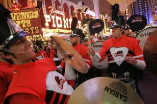 The Oregon State drum line performs at a pep rally on Fremont Street for the Vegas Bowl game between Oregon State and BYU Monday, December 21, 2009.