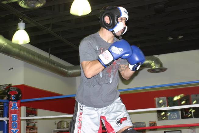 John Gunderson prepares to spar during practice at LA Boxing.