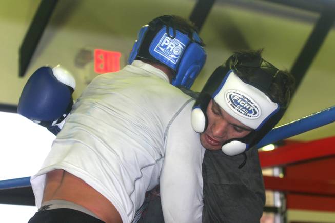 John Gunderson (right0 clinches up with sparring partner Sam Stout during practice at LA Boxing. Both fighters are on the card at UFC 108. 
