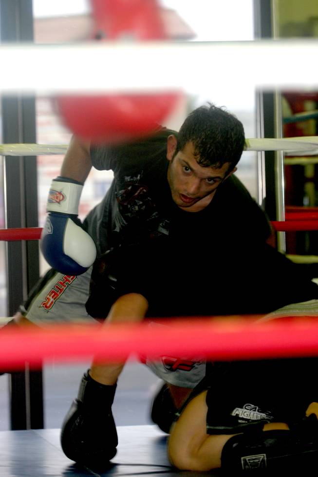 John Gunderson prepares for a little ground and pound on his sparring partner at LA Boxing.