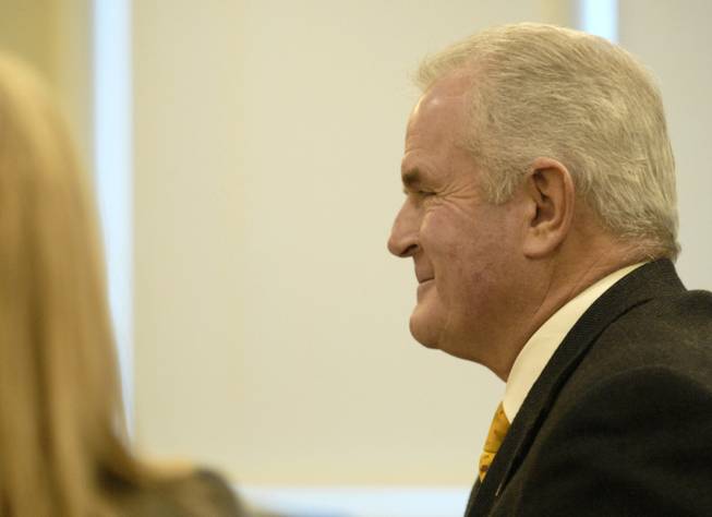 Gov. Jim Gibbons gets a smile on his face just before answering whether he thought the settlement in his divorce case was equitable during a court hearing in Reno on Monday Dec. 28, 2009, regarding his divorce from Dawn Gibbons. After the smile he told the judge he did think it was fair.