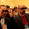 Visitors to the Mitsubishi booth view the new 3D televisions at the CES Unveiled event Tuesday at the Venetian.