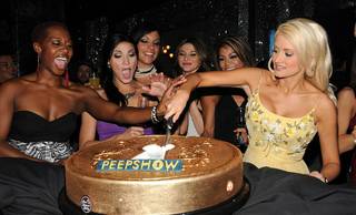 Holly Madison, right, and the cast of Peepshow celebrate the show's first anniversary with a signature Peepshow cake at the Chi Theater inside Planet Hollywood on April 18, 2010. 