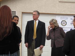 Ranen Ghatak of United Solar Energy talks with Henderson Mayor Andy Hafen and Congresswoman Dina Titus at a gathering Friday in front of Nevada's first rehabilitated foreclosed home. Housing For Nevada hosted the event to recognize homeowner Emma Hurtado.