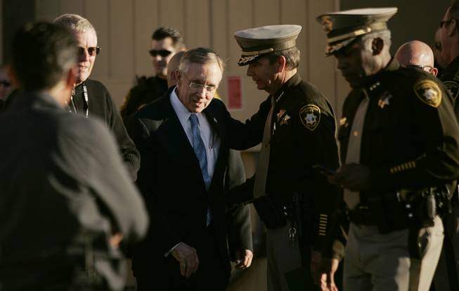 Senate Majority leader Harry Reid, D-Nev., left, with Sheriff Doug Gillespie at the funeral services for slain court security officer Stanley Cooper outside of Central Christian Church in Henderson Monday, January 11, 2010.