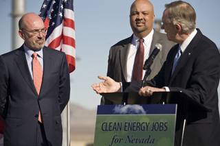 LS Power Chairman and CEO Mike Segel, left, and Western Area Power Authority Administrator Tim Meeks listen as Sen. Harry Reid speaks to media during a press conference at the Harry Allen Generating Plant near Apex, Nev., on Monday, Jan. 11.