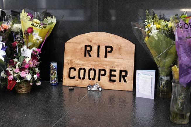A memorial for slain court security officer Stanley Cooper is displayed in the lobby of the Lloyd George Federal Courthouse Monday, Jan. 11, 2010.