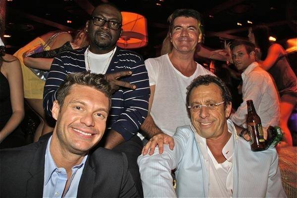 Clockwise from front left, <em>American Idol</em>'s Ryan Seacrest, Randy Jackson and Simon Cowell with Victor Drai in Victor's VIP booth at XS in the Encore on April 27, 2009.