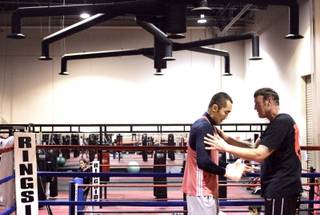 Trainer Kevin Barry works with light heavyweight boxer Beibut Shumenov at Elite Boxing Gym in Henderson Monday, January 18, 2010.