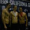 Boulder City High senior Zane Grothe, center, stands with swimming legend Michael Phelps (left) and Swiss Olympian Dominik Meichtry on Saturday after the trio received medals at the Southern California Swimming Grand Prix in Long Beach, Calif. Grothe took third in the 500 freestyle, a race won by the swimming legend Phelps.