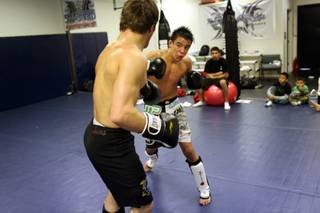 WEC bantamweight fighter Miguel Torres, facing, works out at Robert Drysdale gym Jan. 19 in Las Vegas.