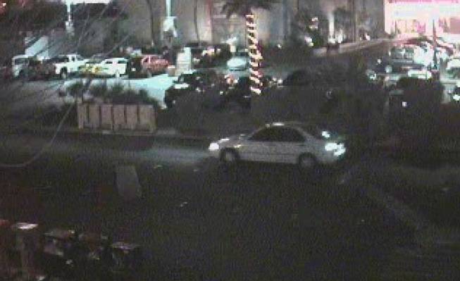Metro Police say someone exited this white car at Hooters on the Strip and approached the vehicle of a woman who was later found dead in her abandoned car. 