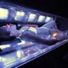 Alicia Jaeger lies in a filter glass tanning bed Saturday at a BodyHeat tanning salon in Henderson. 