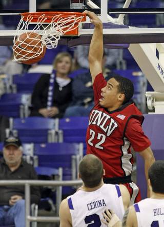 UNLV's Chace Stanback, top, dunks over TCU players Nikola Cerina and Zvonko Buljan in the first half of UNLV's 79-70 victory on Jan. 23, 2010, at Daniel-Meyer Coliseum in Fort Worth, Texas.