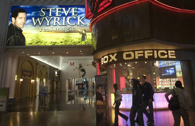 Shoppers pass by the closed Steve Wyrick Theatre in the Miracle Mile Shops at Planet Hollywood last month. Wyrick's $34 million theater that seats 500 people opened in early 2007 -- right before the recession reduced visitation to Las Vegas.  