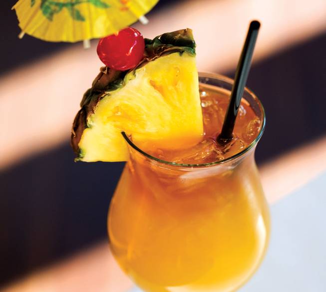 <strong>Ingredients:</strong> 1 part Tommy Bahama White Sand rum; 1 part pineapple juice; 1 part Tommy Bahama Golden Sun rum; 1 part fresh orange juice; 1 part orange Cura&#231;ao; 1/4 part fresh lime juice; 1 part orgeat syrup; 1/4 part dark rum<br />
Tommy Bahama's take on the classic island drink sports its namesake rum in two varieties, Sand and Sun, plus a host of juices that whisk you away to blue waters and sandy beaches. To try it at home, shake all ingredients together with ice and float the dark rum on top. Garnish with a pineapple wedge, maraschino cherry and parasol.